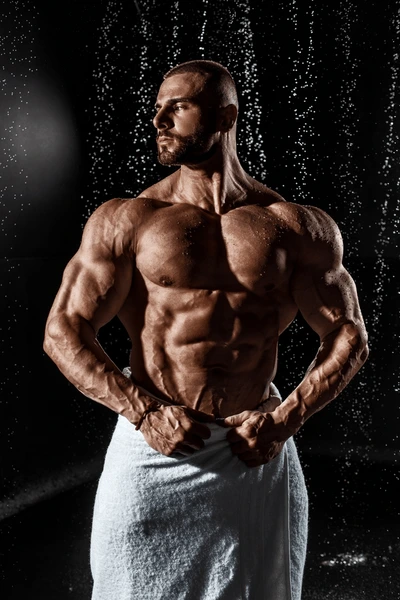 muscular-man-under-rain-studio-600nw-2580177909